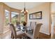 Comfortable dining area offers beautiful views and great lighting at 7141 Red Mesa Dr, Littleton, CO 80125