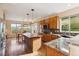 Bright kitchen with oak cabinets, granite counters and stainless steel appliances at 7141 Red Mesa Dr, Littleton, CO 80125