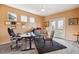 Cozy home office with natural light, a ceiling fan, and access to the outdoor balcony at 7141 Red Mesa Dr, Littleton, CO 80125