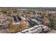 Aerial view of condo complex near a lake with city skyline in the background at 1496 S Pierson St # 116, Denver, CO 80232