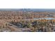 Great aerial view showcases the neighborhood's proximity to the local lake and city skyline at 1496 S Pierson St # 116, Denver, CO 80232