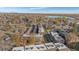 Aerial view of condo complex with a pool and surrounding landscape at 1496 S Pierson St # 116, Denver, CO 80232