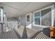 Charming front porch entrance, featuring ample natural light and updated fixtures at 1496 S Pierson St # 116, Denver, CO 80232