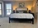 Main bedroom featuring a king-size bed and calming decor at 1496 S Pierson St # 116, Denver, CO 80232