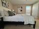 Main bedroom showcasing a comfy bed and neutral palette at 1496 S Pierson St # 116, Denver, CO 80232