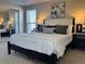 Spacious main bedroom with a plush bed and modern decor at 1496 S Pierson St # 116, Denver, CO 80232