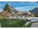 Community swimming pool with surrounding landscaping at 1496 S Pierson St # 116, Denver, CO 80232