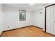 Finished basement room with hardwood floor and window at 1104 Elmer Dr, Northglenn, CO 80233