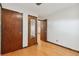 Basement bedroom with hardwood floors and closets at 1104 Elmer Dr, Northglenn, CO 80233