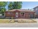 Brick ranch home with attached garage and front porch at 1104 Elmer Dr, Northglenn, CO 80233