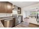 Modern kitchen with stainless steel appliances and a breakfast bar at 1104 Elmer Dr, Northglenn, CO 80233