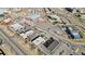 Aerial view of commercial buildings and parking lots, showcasing the business district at 1973 Alton St, Aurora, CO 80010