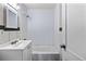 This bathroom features a shower and a vanity with a sink at 1973 Alton St, Aurora, CO 80010