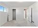 Bright bedroom featuring fresh paint, plush carpet and large window at 1973 Alton St, Aurora, CO 80010