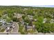 Panoramic aerial view of a neighborhood with lush green trees and well-maintained homes at 6025 Johnson Way, Arvada, CO 80004
