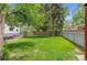 A grass backyard featuring partial privacy fence at 6025 Johnson Way, Arvada, CO 80004