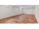 Large basement with wood flooring and a window at 6025 Johnson Way, Arvada, CO 80004
