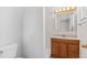 Bathroom featuring tile floors, wooden vanity, and a shower/tub combo at 6025 Johnson Way, Arvada, CO 80004