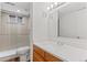 Updated bathroom featuring a large mirror, and walk-in shower at 6025 Johnson Way, Arvada, CO 80004