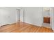 Empty bedroom offers hardwood flooring with an attached bathroom at 6025 Johnson Way, Arvada, CO 80004