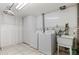 Bright laundry room features ample space for storage at 6025 Johnson Way, Arvada, CO 80004