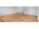 Bright living room featuring gleaming hardwood floors and fresh paint, offering a modern and inviting space at 6025 Johnson Way, Arvada, CO 80004