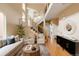 Open living room with high ceilings, staircase, and plenty of natural light at 2940 Ulster St, Denver, CO 80238