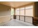 Cozy covered patio with wood floors and open views, great for outdoor relaxation at 2940 Ulster St, Denver, CO 80238