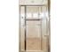 Clean and bright shower with glass doors, tile surround, and dual shower heads at 2940 Ulster St, Denver, CO 80238