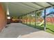 Covered concrete patio features play set on artificial grass for low maintenance fun at 2692 S Pennsylvania St, Denver, CO 80210