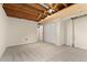 Finished basement area with carpet flooring, a closet and utility access at 2692 S Pennsylvania St, Denver, CO 80210