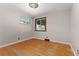 Empty bedroom features hardwood floors and large windows for natural light at 2692 S Pennsylvania St, Denver, CO 80210