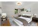 Bright bedroom with a large bed, stylish rug, and modern décor at 2692 S Pennsylvania St, Denver, CO 80210