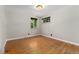 Bedroom with hardwood floors and a Tiffany-style light fixture at 2692 S Pennsylvania St, Denver, CO 80210