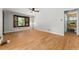Bright living room with hardwood floors and a large window overlooking the yard at 2692 S Pennsylvania St, Denver, CO 80210