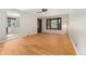 Bright living room featuring hardwood floors, bay window, and ceiling fan at 2692 S Pennsylvania St, Denver, CO 80210