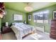 Bright bedroom with a big window and a modern pendant light fixture at 500 E 11Th Ave # 305, Denver, CO 80203
