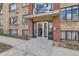 Apartment building entrance featuring brick facade and glass doors to welcome residents and guests alike at 500 E 11Th Ave # 305, Denver, CO 80203