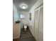 Bathroom with new flooring, modern toilet, and new fixtures at 4995 N Beach Ct, Denver, CO 80221