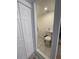 Half bathroom featuring tile floor and convenient access to the main living space at 4995 N Beach Ct, Denver, CO 80221