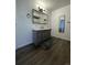Bathroom with an updated vanity, sink, mirror, and modern lighting at 4995 N Beach Ct, Denver, CO 80221