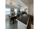 Bright dining room with open view of kitchen, modern fixtures, and cozy seating at 4995 N Beach Ct, Denver, CO 80221
