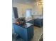 Updated kitchen features modern cabinetry, countertops, and appliances, including a microwave and dishwasher at 4995 N Beach Ct, Denver, CO 80221