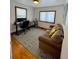 Office/flex space features wood floors, natural light, and a decorative area rug at 4995 N Beach Ct, Denver, CO 80221