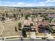 Aerial view of a neighborhood featuring a house with a carport and spacious surrounding landscape at 12119 S Wanderlust Way, Parker, CO 80138