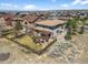 Aerial view of a fenced backyard with a pergola and seating area, perfect for outdoor living at 12119 S Wanderlust Way, Parker, CO 80138