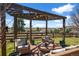 Relaxing backyard with a covered patio, comfortable seating, and beautiful views at 12119 S Wanderlust Way, Parker, CO 80138