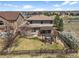 A spacious backyard features a pergola and seating area, surrounded by a wooden fence at 12119 S Wanderlust Way, Parker, CO 80138