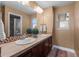 Traditional bathroom features double sinks, a large mirror, and neutral decor at 12119 S Wanderlust Way, Parker, CO 80138