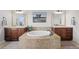 Luxurious bathroom featuring double vanities, a soaking tub, and stylish fixtures at 12119 S Wanderlust Way, Parker, CO 80138